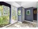 Interior entryway is decorated with lush potted plants, wall art, and grey paint at 8101 N Central Ave # 6, Phoenix, AZ 85020