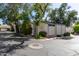 Exterior view of a home's corner and features neutral stucco and trimmed with green paint at 8101 N Central Ave # 6, Phoenix, AZ 85020