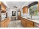 Charming kitchen with granite counters, wood cabinetry, and an eat-in breakfast area at 8101 N Central Ave # 6, Phoenix, AZ 85020