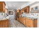 Spacious kitchen with wood cabinets, granite countertops, and modern appliances at 8101 N Central Ave # 6, Phoenix, AZ 85020