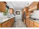 Updated kitchen features wood cabinets, granite countertops, and stainless steel appliances at 8101 N Central Ave # 6, Phoenix, AZ 85020