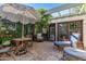 Charming outdoor patio with stone flooring, lush greenery, and comfortable seating under a unique umbrella at 8101 N Central Ave # 6, Phoenix, AZ 85020