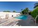 Refreshing backyard pool with surrounding lounge chairs and privacy landscaping, ideal for relaxation and recreation at 8101 N Central Ave # 6, Phoenix, AZ 85020
