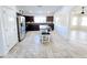 Kitchen with island, dark cabinets, stainless steel appliances and tile floor at 2805 E Desert Rose Trl, San Tan Valley, AZ 85143