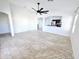 Spacious living room with tile flooring and ceiling fan at 2805 E Desert Rose Trl, San Tan Valley, AZ 85143