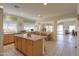 Spacious kitchen featuring an island, tile floors, and ample natural light at 29922 N Little Leaf Dr, San Tan Valley, AZ 85143
