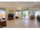 Bright living room with sliding glass doors providing access to the backyard at 29922 N Little Leaf Dr, San Tan Valley, AZ 85143