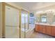 Bathroom featuring a glass shower enclosure, soaking tub, and double sink vanity at 29922 N Little Leaf Dr, San Tan Valley, AZ 85143