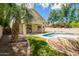 Relaxing outdoor area with a pool and well-manicured lawn at 3327 S Felix Way, Chandler, AZ 85248