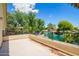 Balcony overlooking a calm lake and lush green trees with blue sky at 3327 S Felix Way, Chandler, AZ 85248
