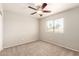 Bedroom with neutral carpet, ceiling fan, and a window at 3327 S Felix Way, Chandler, AZ 85248