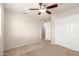 Bedroom with neutral carpet, ceiling fan, and closet at 3327 S Felix Way, Chandler, AZ 85248