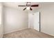Bedroom with neutral carpet, ceiling fan and access to an attached room at 3327 S Felix Way, Chandler, AZ 85248