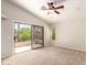 Bedroom with sliding glass door, a ceiling fan and a view to the balcony at 3327 S Felix Way, Chandler, AZ 85248