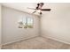 Bedroom with neutral carpet, ceiling fan and window with natural lighting at 3327 S Felix Way, Chandler, AZ 85248