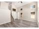 Bright and airy living room showcasing vaulted ceilings, hardwood floors, and staircase access to upper level at 3327 S Felix Way, Chandler, AZ 85248