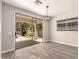 Living room features sliding glass doors with views of a lake beyond the covered patio at 3327 S Felix Way, Chandler, AZ 85248