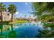Scenic waterfront view with lush landscaping and tranquil water at 3327 S Felix Way, Chandler, AZ 85248