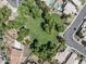 Aerial view of a neighborhood featuring mature trees and lush green spaces, near residential properties at 2390 S Walnut Dr, Chandler, AZ 85286