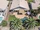 Aerial view showcasing a backyard with a pool, covered patio, and meticulously manicured landscaping at 2390 S Walnut Dr, Chandler, AZ 85286