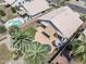 Aerial view of a private backyard featuring a pool, patio, and mature palm trees at 2390 S Walnut Dr, Chandler, AZ 85286