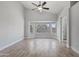 Bright bedroom with tiled floors, large bay window and vaulted ceiling with fan at 2390 S Walnut Dr, Chandler, AZ 85286