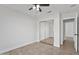 Bedroom with tiled floors, ceiling fan and a closet with mirrored doors at 2390 S Walnut Dr, Chandler, AZ 85286