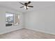 Bedroom with tiled floors, a ceiling fan and a large window overlooking the property at 2390 S Walnut Dr, Chandler, AZ 85286