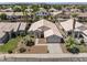 Expansive aerial view of single-story home with desert landscaping and tile roof in a neighborhood at 2390 S Walnut Dr, Chandler, AZ 85286