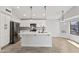 Well-lit kitchen featuring a large island, stainless steel appliances, and shaker cabinets at 2390 S Walnut Dr, Chandler, AZ 85286