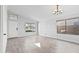 Bright, open living room with wood-look tile floors, neutral walls, and updated lighting at 2390 S Walnut Dr, Chandler, AZ 85286