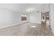 Empty living room with a large window and light wood-look tile flooring at 2390 S Walnut Dr, Chandler, AZ 85286