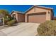 Charming home with a two car garage and a well-manicured yard at 22882 E Marsh Rd, Queen Creek, AZ 85142