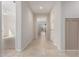 Bright hallway with tile flooring and neutral walls, leading into the main living areas of the home at 22882 E Marsh Rd, Queen Creek, AZ 85142