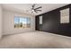 Spacious main bedroom with a large window providing natural light and a view to the outside at 22882 E Marsh Rd, Queen Creek, AZ 85142