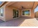 Relaxing covered patio with tile flooring, ceiling fan, and outdoor space at 22882 E Marsh Rd, Queen Creek, AZ 85142