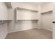 Walk-in closet with carpet and built in shelving for storage at 22882 E Marsh Rd, Queen Creek, AZ 85142