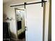 Bathroom with barn door, shower, and modern vanity at 7213 S 12Th Pl, Phoenix, AZ 85042