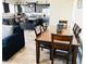 Dining area adjacent to the kitchen with a large wooden table at 7213 S 12Th Pl, Phoenix, AZ 85042