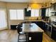 Spacious kitchen with granite countertops and dark cabinetry at 7213 S 12Th Pl, Phoenix, AZ 85042