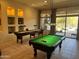 Entertaining game room with pool table and shuffleboard, perfect for Gathering and friends at 30793 N 77Th Way, Scottsdale, AZ 85266