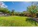 Spacious backyard with grassy area and mature trees at 42608 N 46Th Ave, New River, AZ 85087