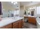 Elegant bathroom with double sinks and a large mirror at 42608 N 46Th Ave, New River, AZ 85087