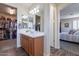 Double vanity bathroom with large closet access at 42608 N 46Th Ave, New River, AZ 85087