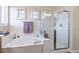 Spa-like bathroom with soaking tub and walk-in shower at 42608 N 46Th Ave, New River, AZ 85087