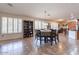 Dining area with a round table and view into living room at 42608 N 46Th Ave, New River, AZ 85087