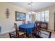 Elegant dining room featuring a large oval table and chandelier at 42608 N 46Th Ave, New River, AZ 85087