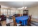 Formal dining room with a wooden table and blue tablecloth at 42608 N 46Th Ave, New River, AZ 85087