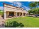 Two-story house with covered patio and grassy backyard at 42608 N 46Th Ave, New River, AZ 85087