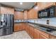 Well-equipped kitchen with granite countertops and stainless steel appliances at 42608 N 46Th Ave, New River, AZ 85087